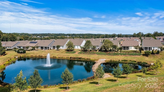 birds eye view of property with a residential view and a water view