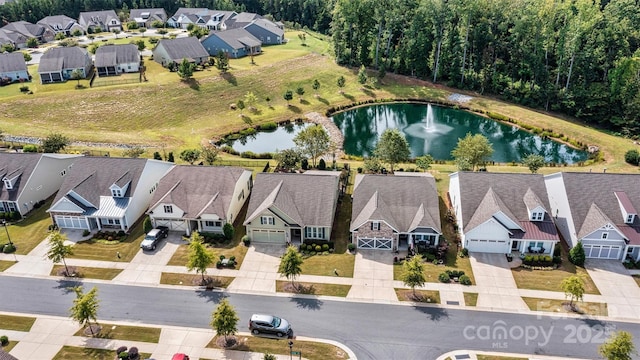 aerial view with a residential view and a water view