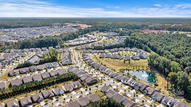 birds eye view of property featuring a residential view and a water view