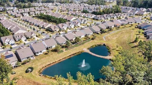 aerial view with a residential view and a water view