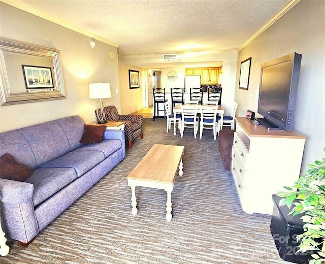 living room with a textured ceiling, ornamental molding, and dark colored carpet