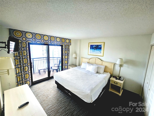 bedroom with carpet, a closet, access to exterior, and a textured ceiling