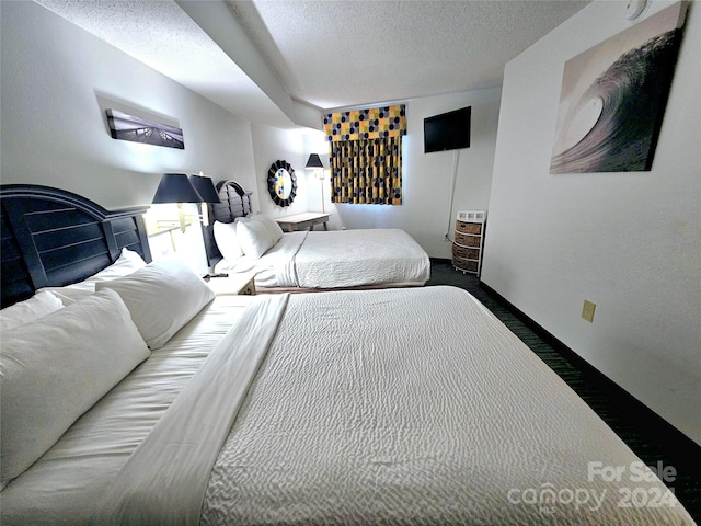 bedroom featuring a textured ceiling