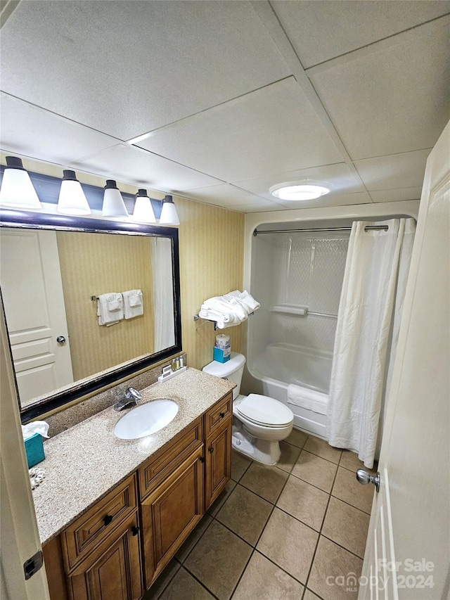 full bathroom featuring vanity, toilet, tile patterned floors, and shower / bath combo with shower curtain