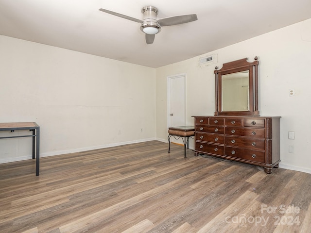 interior space featuring ceiling fan and dark wood-type flooring