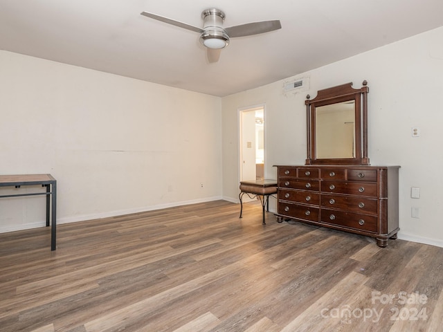 bedroom with wood-type flooring and ceiling fan