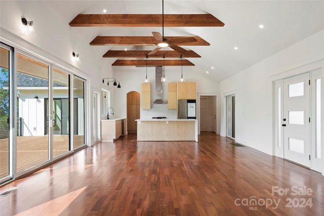 unfurnished living room with dark hardwood / wood-style flooring, high vaulted ceiling, ceiling fan, and beamed ceiling