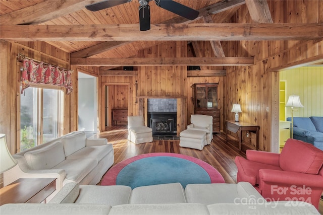 living room featuring a fireplace, lofted ceiling with beams, wood ceiling, wood-type flooring, and ceiling fan