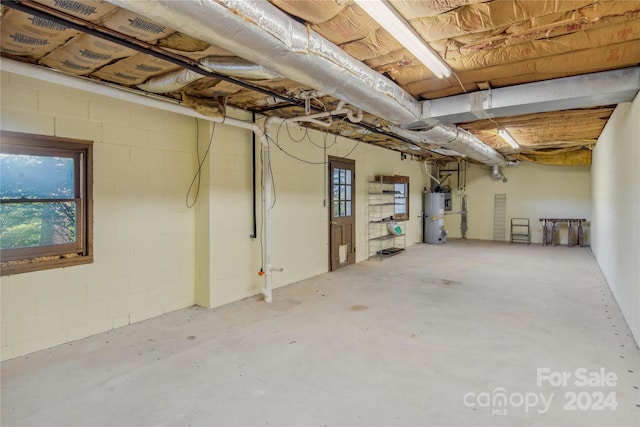 basement featuring water heater