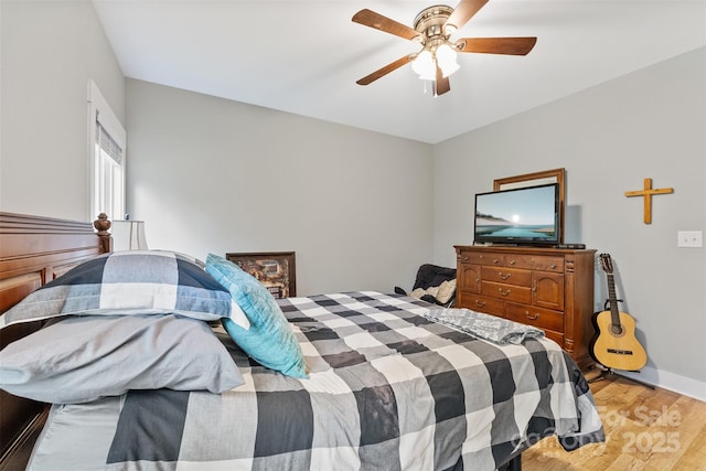 bedroom featuring light hardwood / wood-style floors and ceiling fan