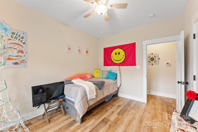 bedroom featuring ceiling fan and light hardwood / wood-style flooring