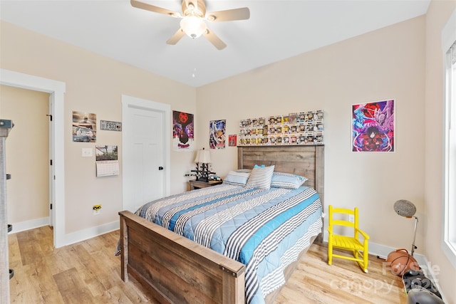 bedroom featuring light hardwood / wood-style flooring and ceiling fan