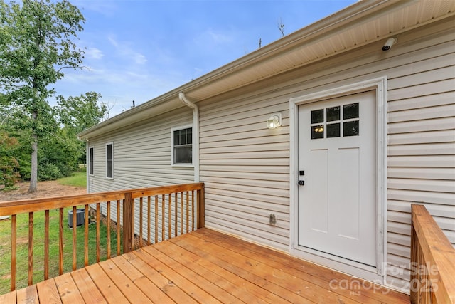 wooden terrace featuring central air condition unit