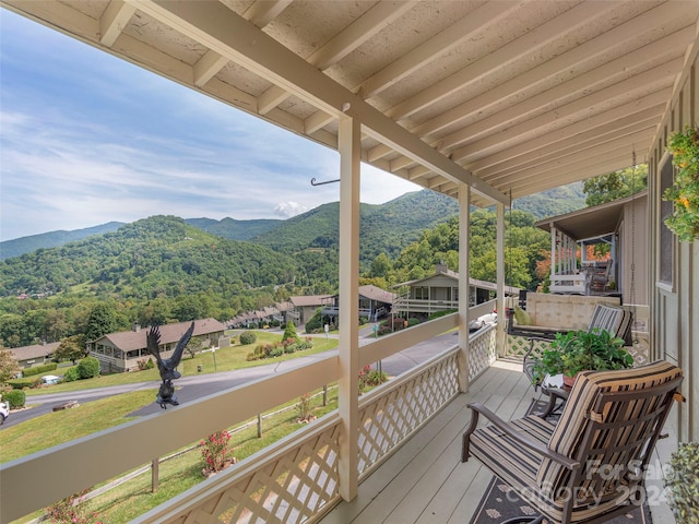 wooden deck featuring a mountain view