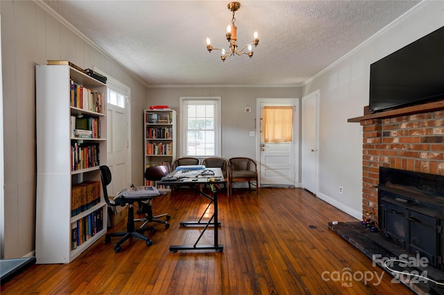 office with ornamental molding, an inviting chandelier, wood-type flooring, and a textured ceiling