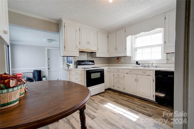 kitchen with black appliances, custom range hood, white cabinets, light hardwood / wood-style floors, and a textured ceiling