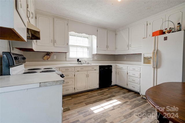 kitchen with light wood-type flooring, white appliances, sink, white cabinetry, and a textured ceiling