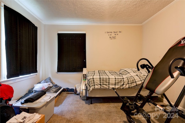 carpeted bedroom featuring a textured ceiling and ornamental molding