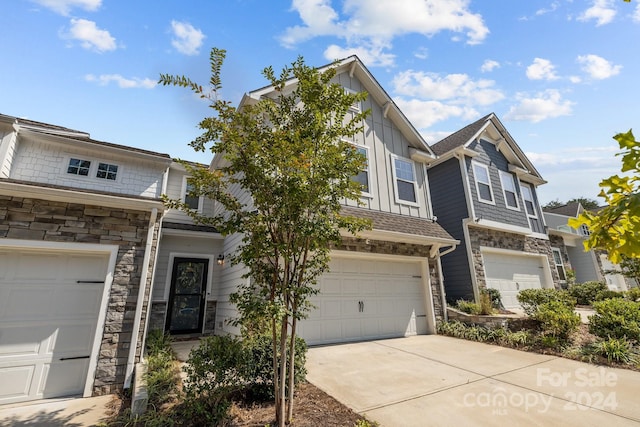 townhome / multi-family property featuring a garage