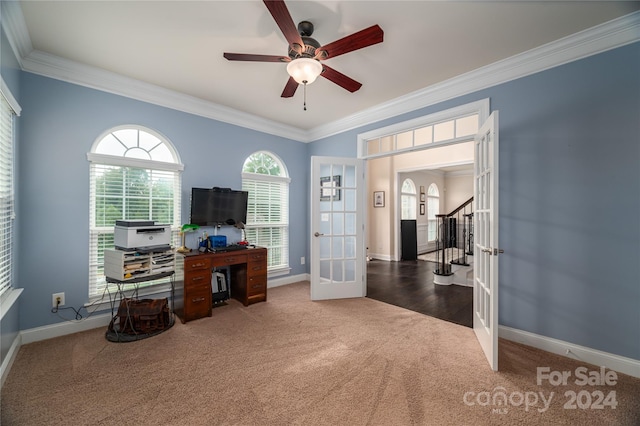 carpeted office space with a ceiling fan, french doors, baseboards, and ornamental molding