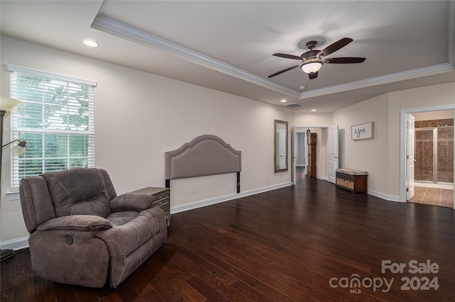 sitting room featuring ornamental molding, a raised ceiling, a ceiling fan, and wood finished floors