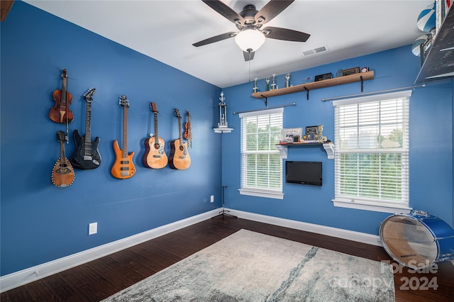 interior space featuring dark hardwood / wood-style flooring and ceiling fan