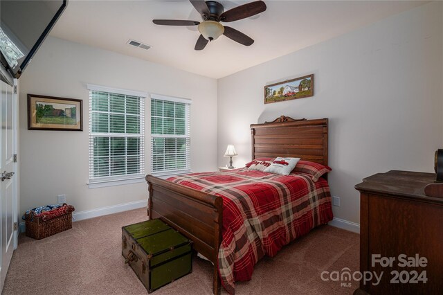 carpeted bedroom featuring ceiling fan