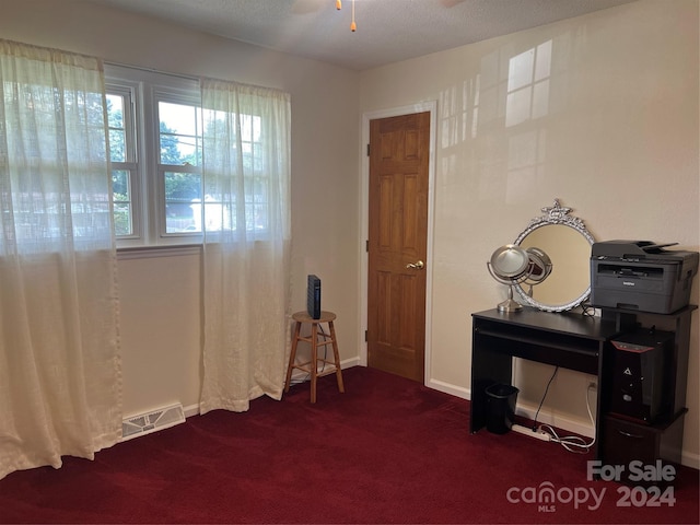 misc room featuring visible vents, a ceiling fan, baseboards, and dark colored carpet