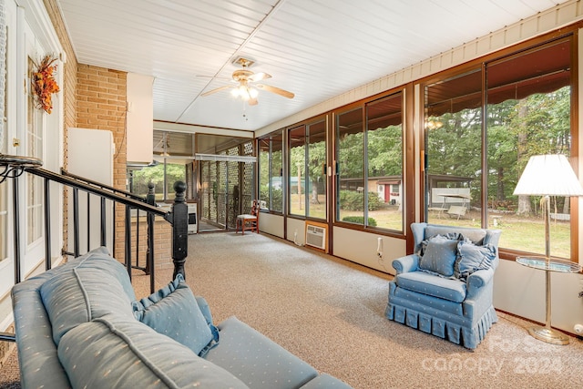 sunroom featuring ceiling fan