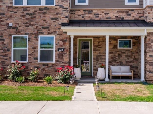 doorway to property with a porch