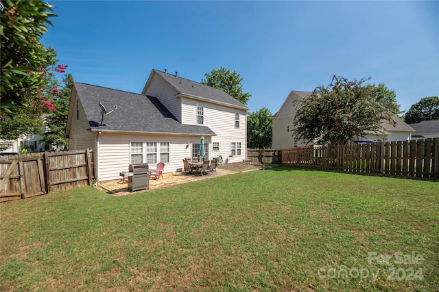 exterior space featuring a lawn and a patio