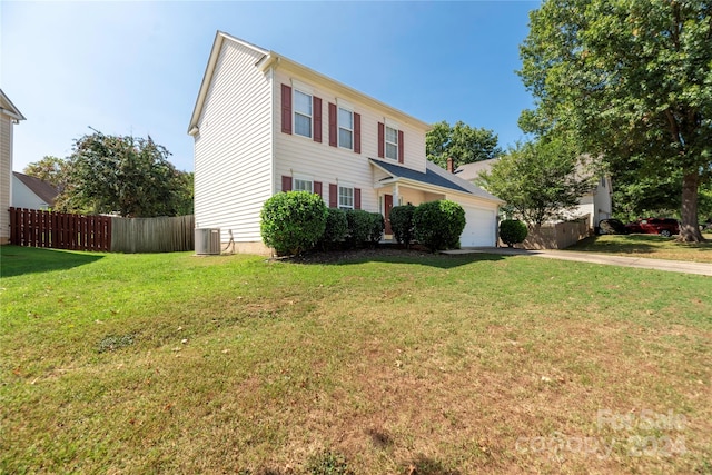 colonial home featuring a garage, a front lawn, and central AC