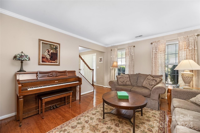 living room featuring hardwood / wood-style floors and ornamental molding