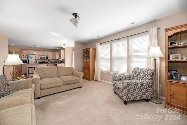 living room with light colored carpet