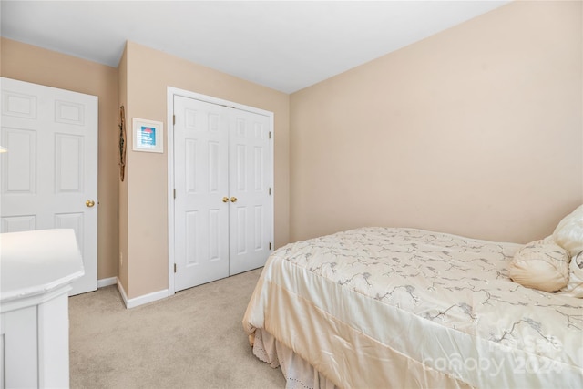 carpeted bedroom featuring a closet