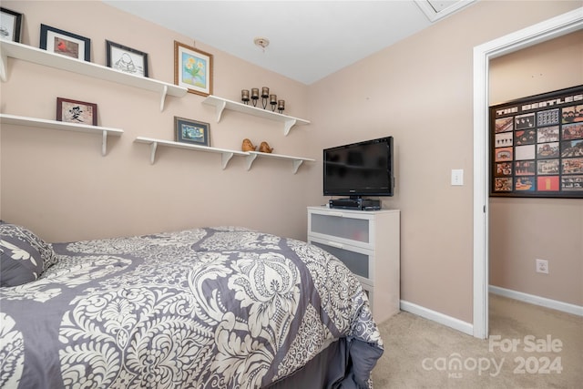 bedroom featuring light carpet