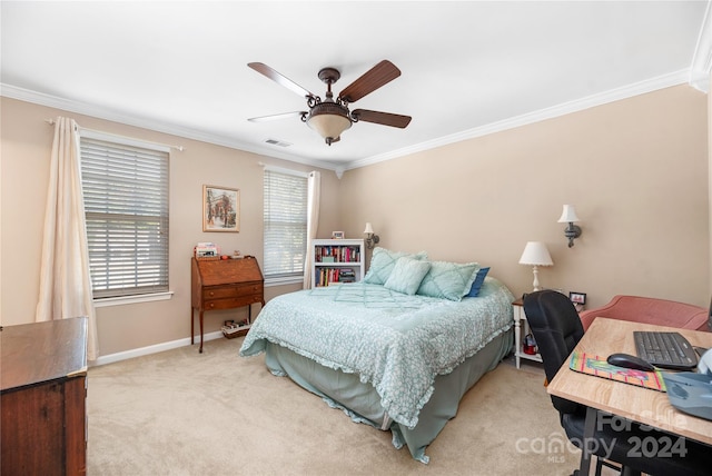 carpeted bedroom featuring crown molding and ceiling fan