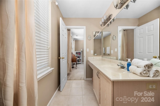 bathroom with vanity and tile patterned flooring