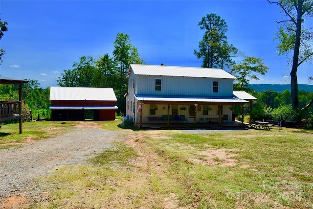 exterior space featuring a front lawn and covered porch