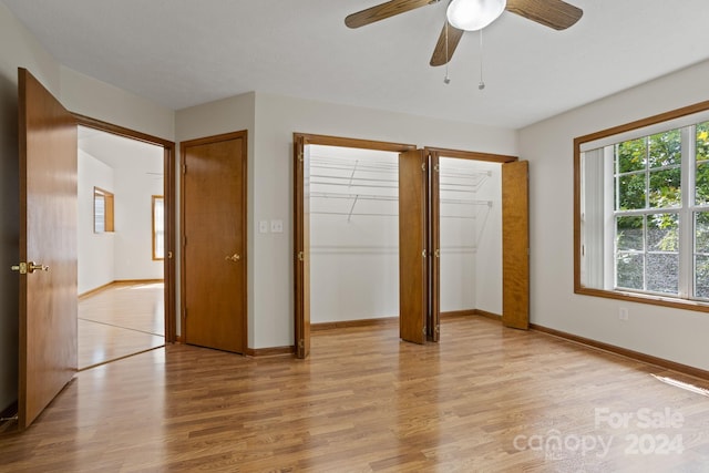 unfurnished bedroom featuring ceiling fan and light wood-type flooring