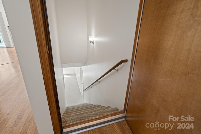 stairway with wood-type flooring