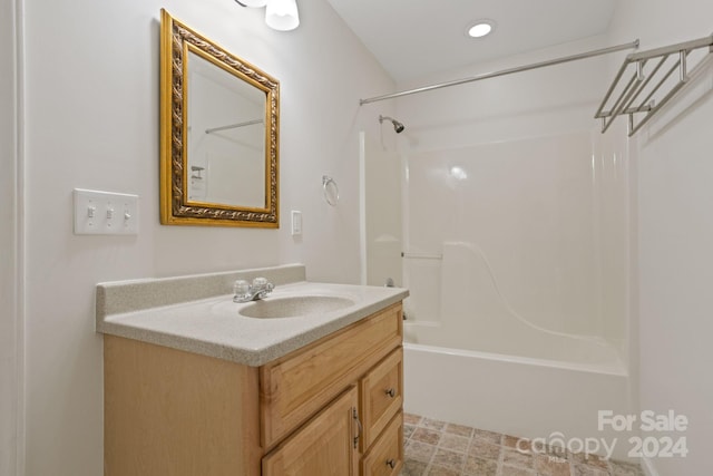 bathroom with vanity and bathing tub / shower combination