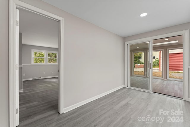 empty room featuring hardwood / wood-style flooring