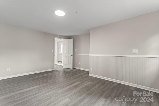 spare room with dark hardwood / wood-style floors