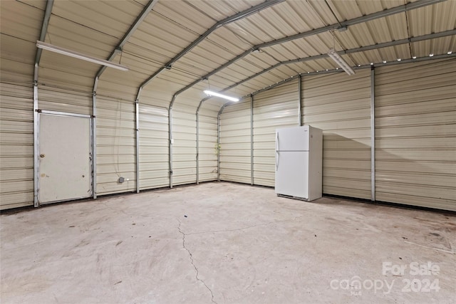 garage with white fridge