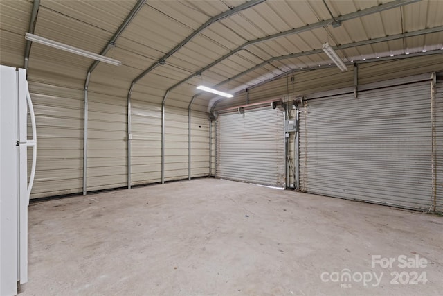 garage with white fridge