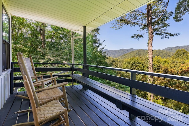 wooden deck featuring a mountain view