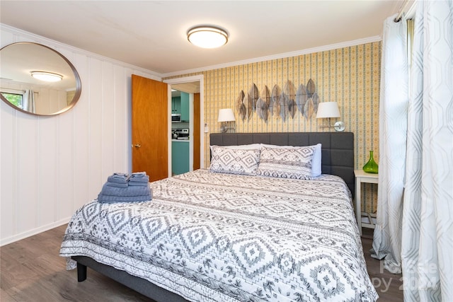 bedroom featuring ornamental molding and dark wood-type flooring