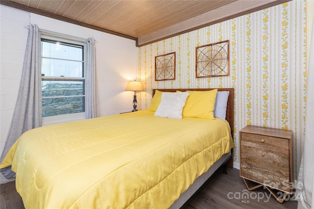 bedroom with crown molding, dark wood-type flooring, and wood ceiling