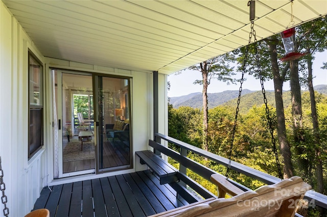 wooden terrace featuring a mountain view